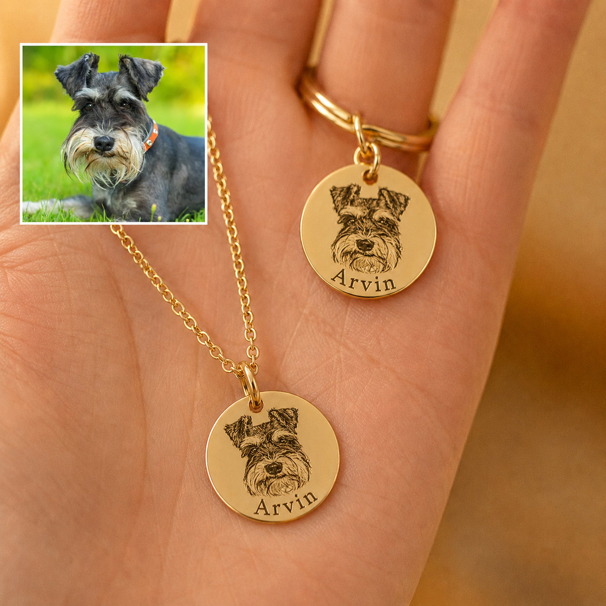 Two custom gold pet portrait necklaces featuring Arvin the Schnauzer